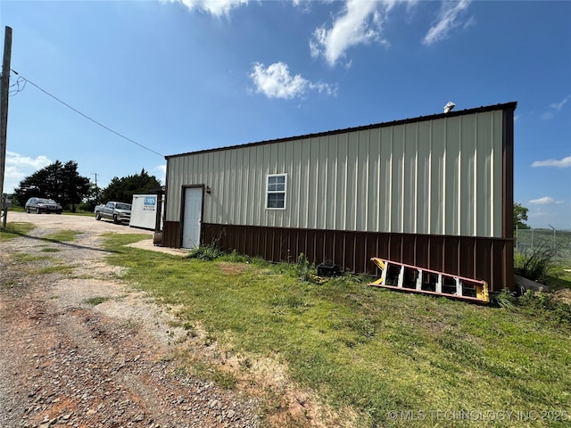 view of property exterior featuring a yard