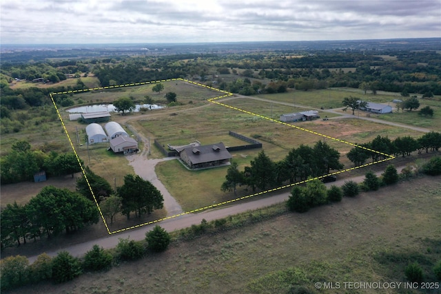 birds eye view of property featuring a rural view