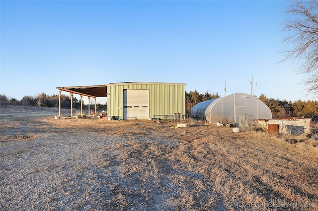 view of outdoor structure with a garage