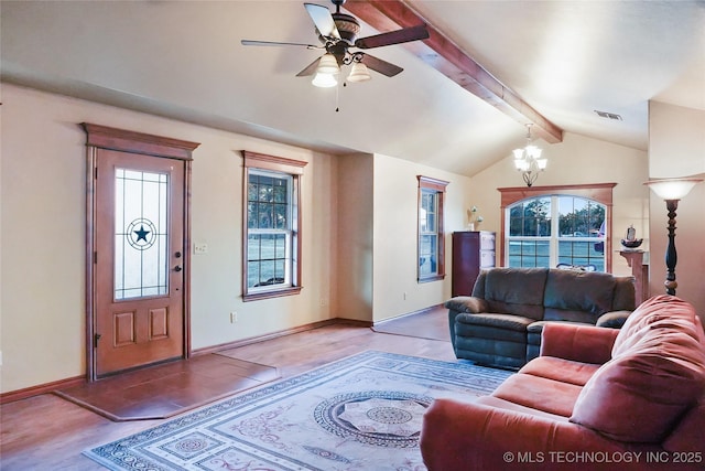 living room with ceiling fan with notable chandelier, wood-type flooring, and vaulted ceiling with beams