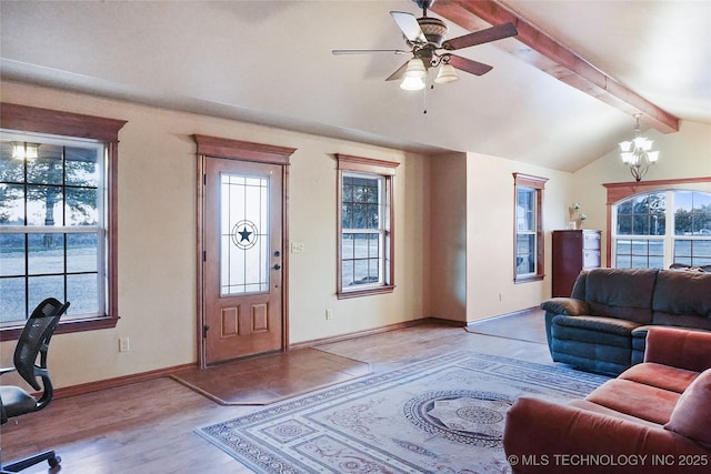 living room with light wood-type flooring, ceiling fan with notable chandelier, and lofted ceiling with beams