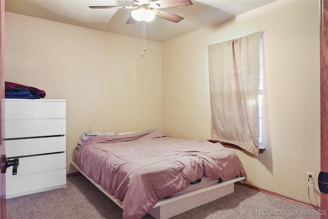 bedroom featuring ceiling fan and light colored carpet