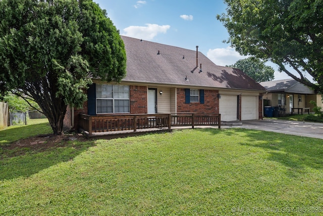 view of front of house with a front yard and a garage