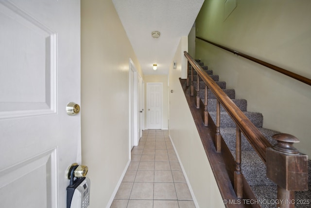 hallway featuring light tile patterned flooring