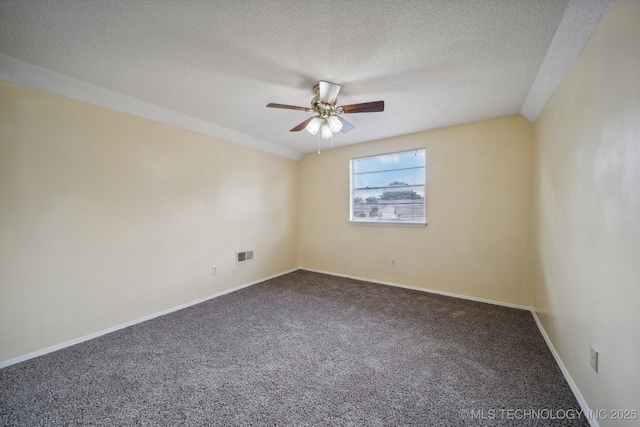 carpeted empty room with a textured ceiling and ceiling fan