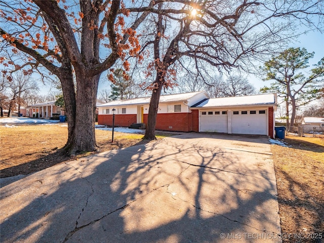 ranch-style home featuring a garage