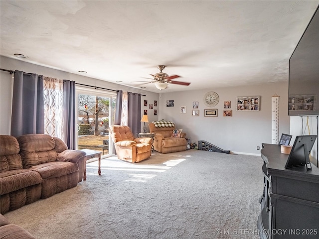 carpeted living room featuring ceiling fan