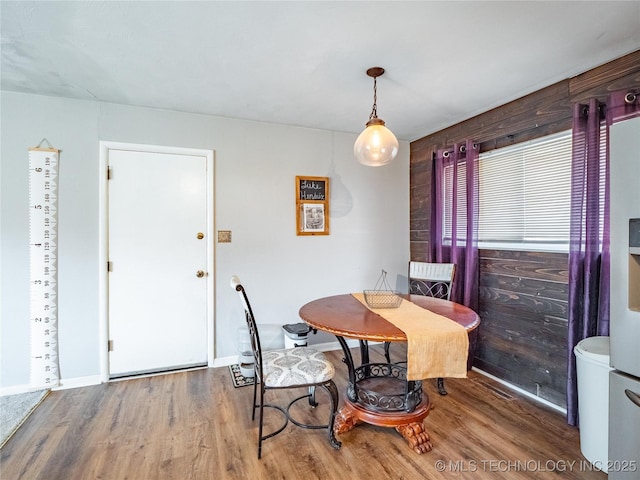 dining room with hardwood / wood-style floors