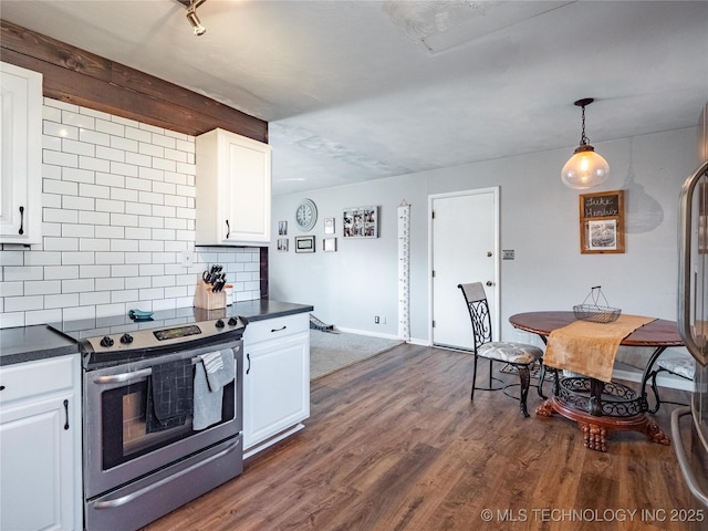 kitchen featuring decorative light fixtures, stainless steel range with electric cooktop, tasteful backsplash, dark hardwood / wood-style flooring, and white cabinets