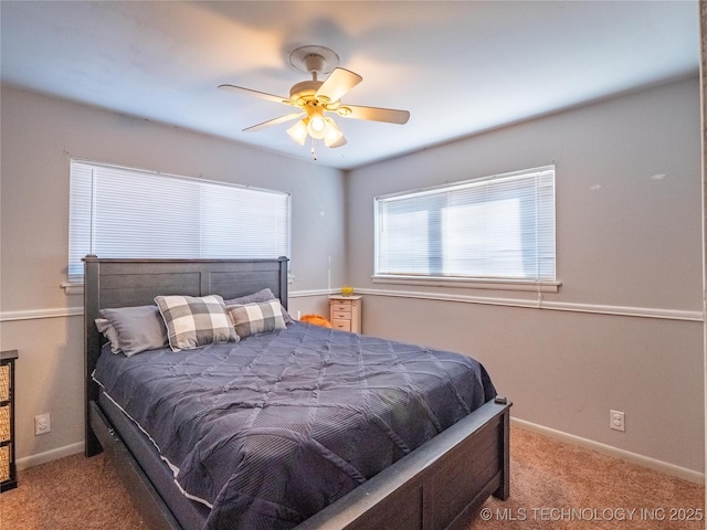 bedroom featuring ceiling fan and light carpet