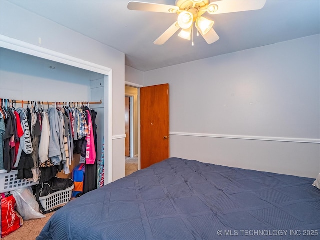 carpeted bedroom featuring a closet and ceiling fan