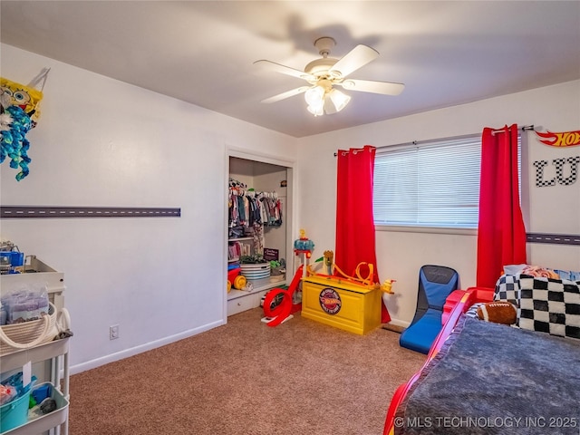 carpeted bedroom with a closet and ceiling fan