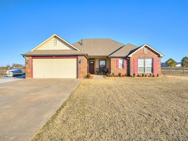 ranch-style home with a front lawn and a garage