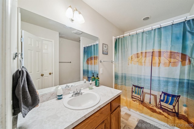 bathroom with a shower with shower curtain and vanity