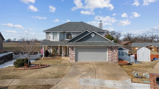 front facade with a front yard, a garage, and a storage unit