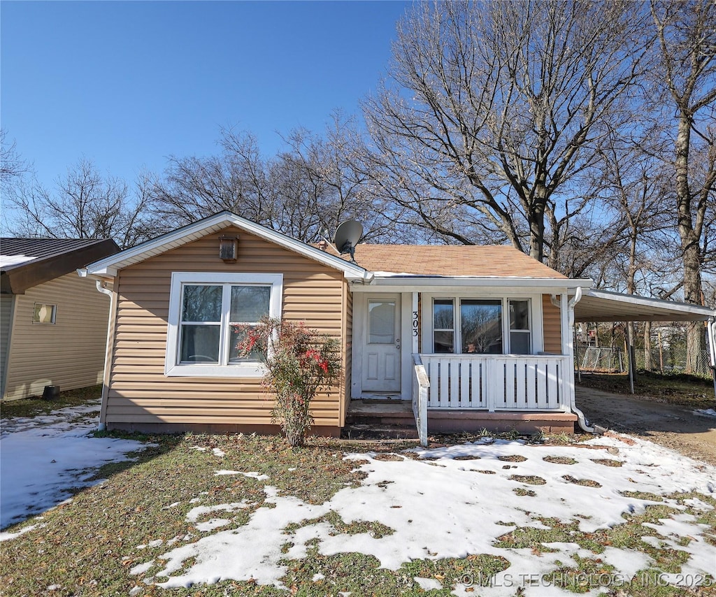 view of front of property with a carport