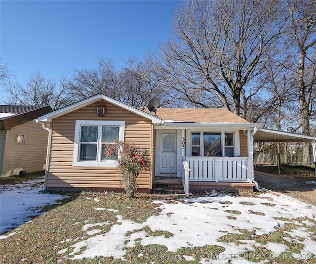 view of front of property with a carport