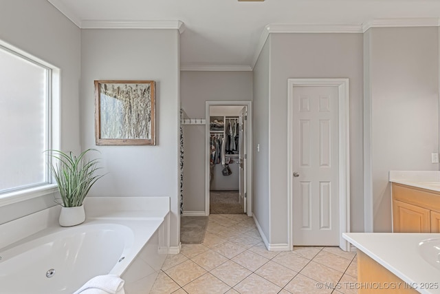 bathroom with vanity, tile patterned flooring, ornamental molding, and a bathtub