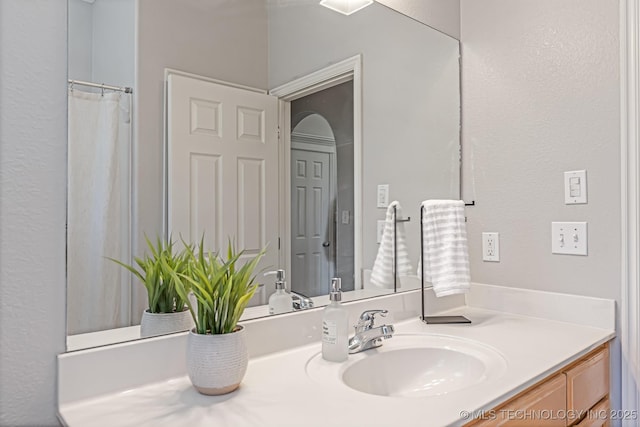 bathroom with vanity and a shower with curtain