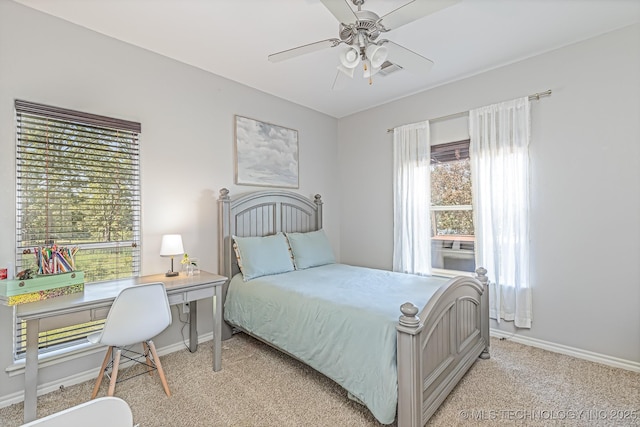 carpeted bedroom with ceiling fan