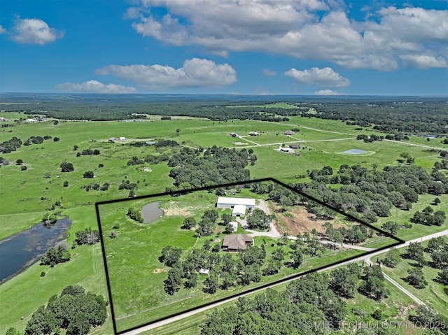 birds eye view of property featuring a rural view and a water view