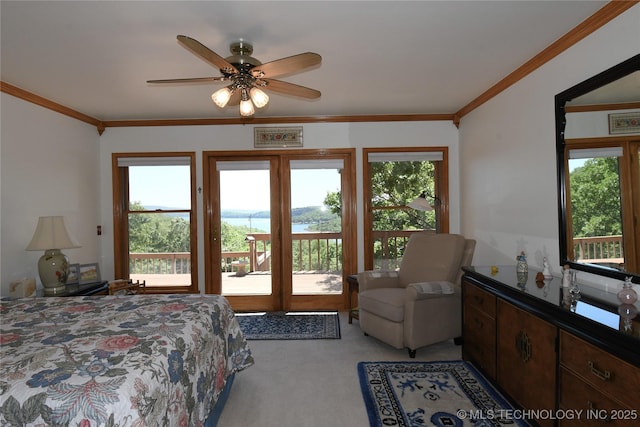 carpeted bedroom featuring ceiling fan, access to outside, and crown molding