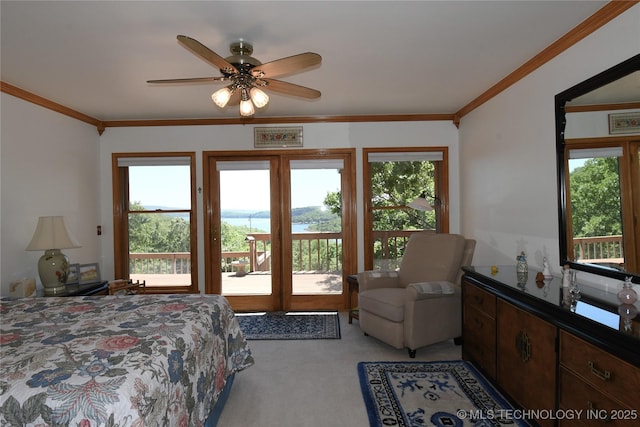 carpeted bedroom featuring ornamental molding, access to outside, and ceiling fan