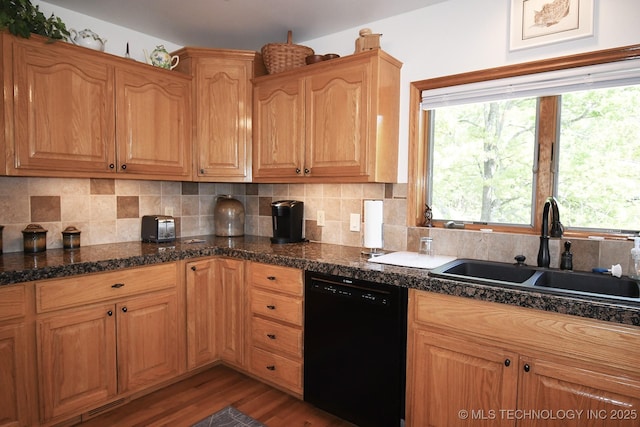 kitchen with dishwasher, a healthy amount of sunlight, a sink, light wood-type flooring, and decorative backsplash