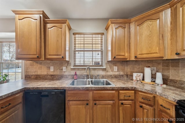 kitchen featuring sink, black dishwasher, and decorative backsplash