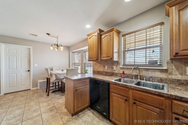 kitchen with tasteful backsplash, a chandelier, black dishwasher, and sink