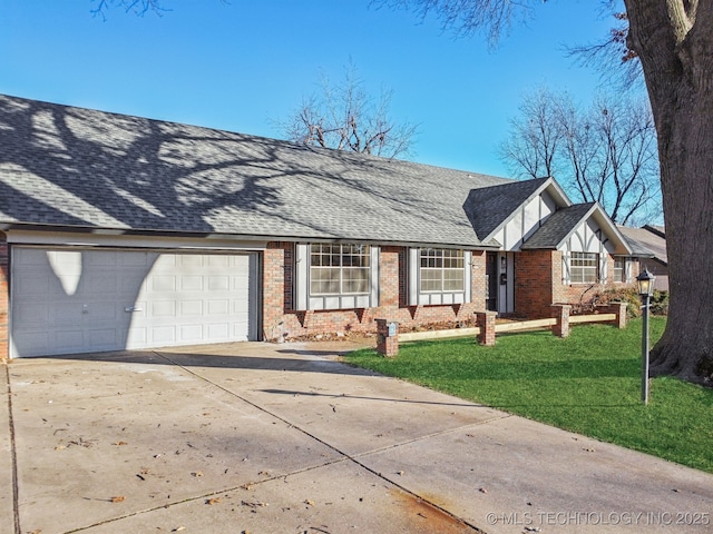 single story home with a front yard and a garage