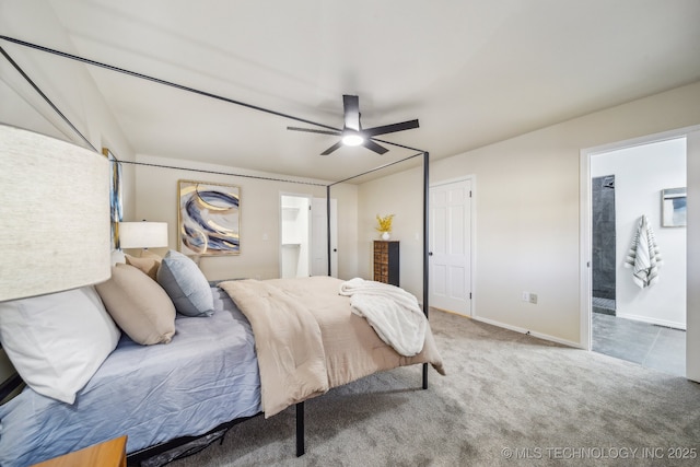 bedroom with ensuite bathroom, carpet floors, and ceiling fan