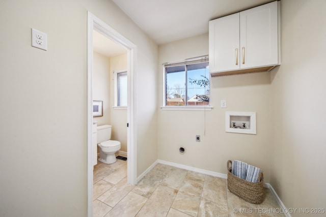 washroom with cabinets, hookup for a washing machine, and hookup for an electric dryer