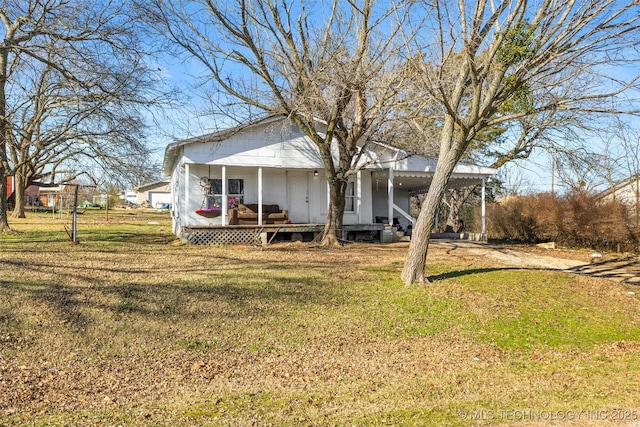 view of front facade with a porch and a front lawn