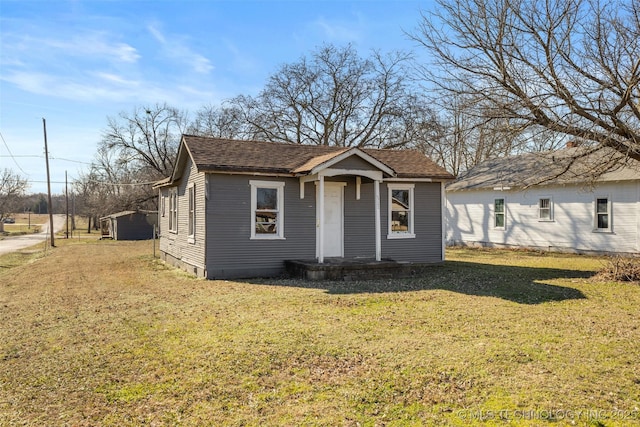 bungalow with a front yard