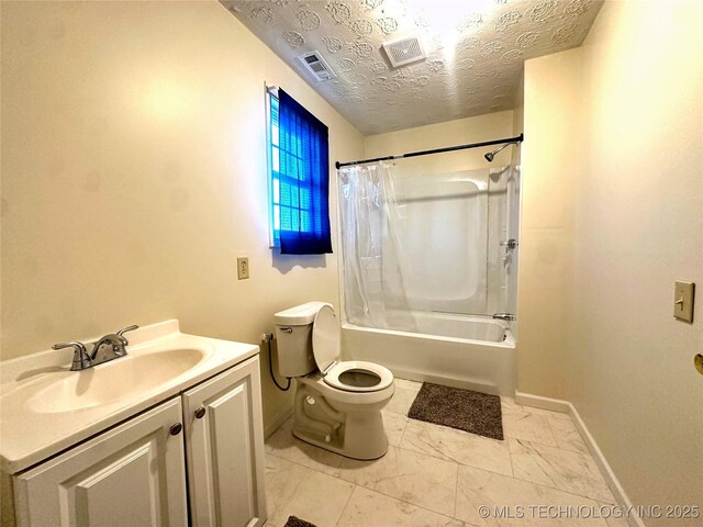 full bathroom with toilet, vanity, a textured ceiling, and shower / bath combo with shower curtain