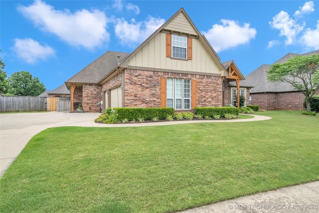 view of front of property with a garage and a front lawn