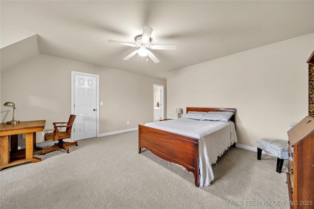 bedroom featuring ceiling fan, vaulted ceiling, and light colored carpet