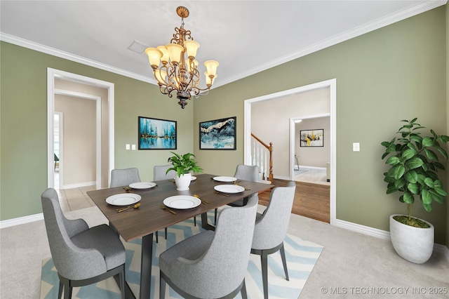 carpeted dining room with a notable chandelier and crown molding