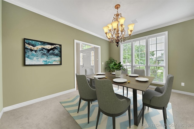 carpeted dining area featuring an inviting chandelier and ornamental molding