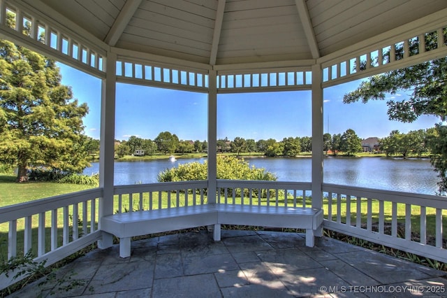 view of patio / terrace with a gazebo and a water view