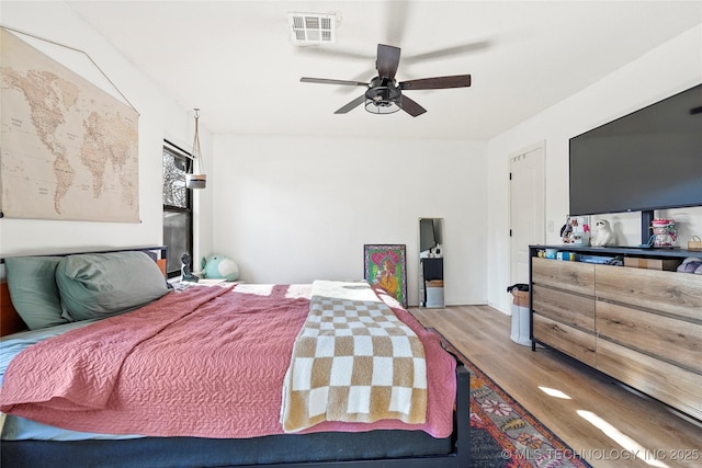 bedroom featuring light wood-type flooring and ceiling fan