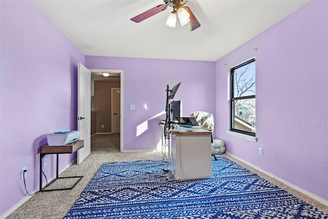 home office featuring ceiling fan and light colored carpet