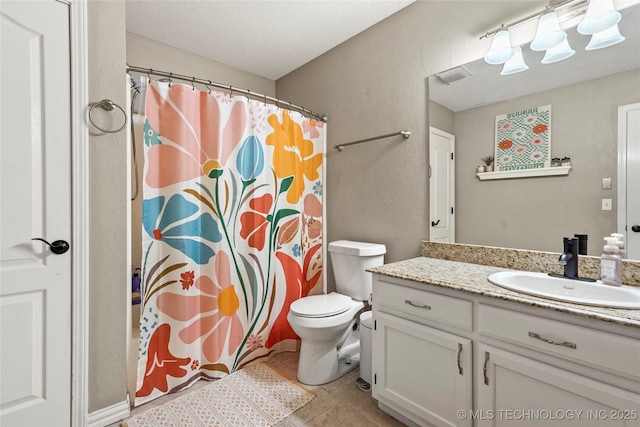 bathroom featuring a shower with curtain, tile patterned flooring, vanity, and toilet