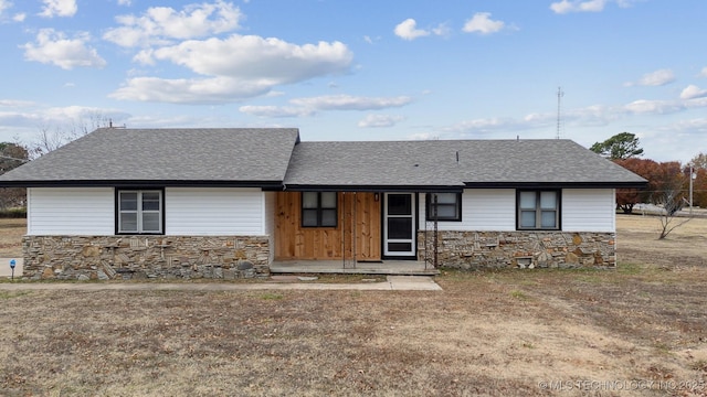 ranch-style house with a front lawn