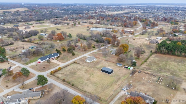 birds eye view of property with a rural view