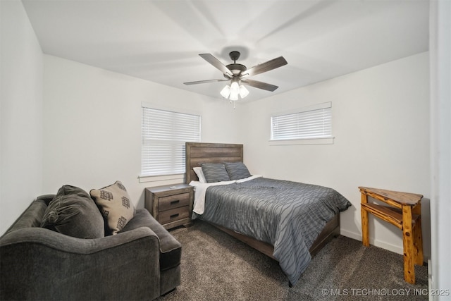 carpeted bedroom with multiple windows and ceiling fan