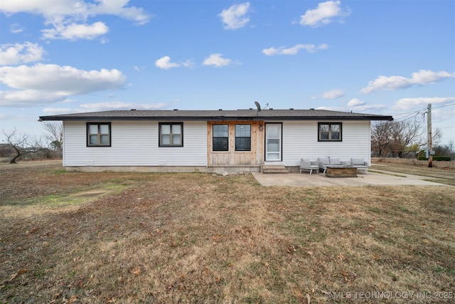 view of front of house with a patio area and a front lawn