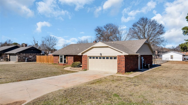 ranch-style house with a front yard and a garage