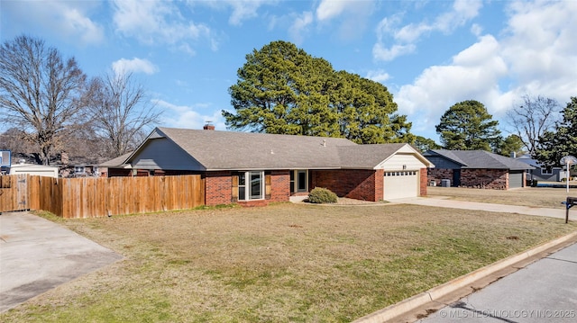 ranch-style home featuring a front yard and a garage